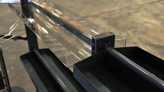 Merchandisable queuing system using integrated steel system and acrylic with Caem UK and Magrini design.